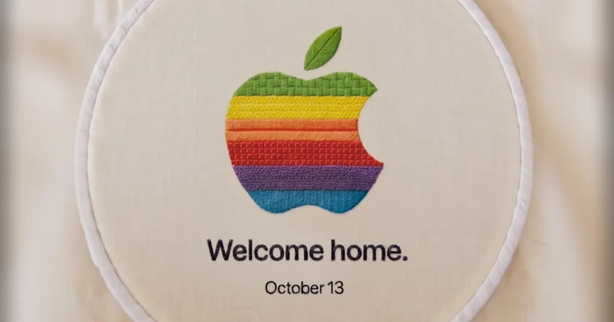 Logo Apple arcobaleno ricamato su tela con la scritta "Welcome home. October 13."